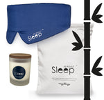 blue bamboo sleep mask, candle and white bamboo pillowcases
